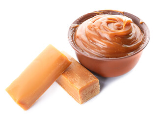Bowl with liquid caramel on white background
