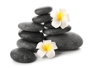 Spa stones and flowers on white background
