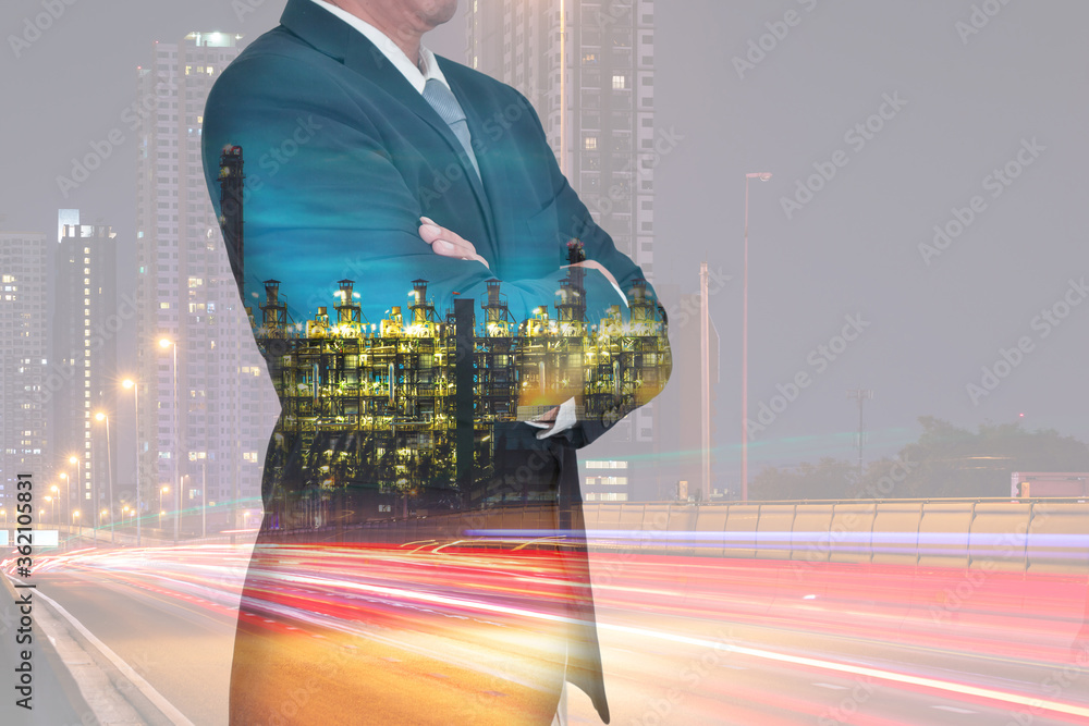 Wall mural double exposure of businessman arms crossed and stand up, light trails on the street and urban, elec