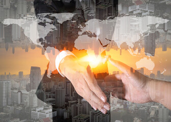 Businessman will handshaking for business relationship, cityscape and sunset as Commitment and Partnership concept.
