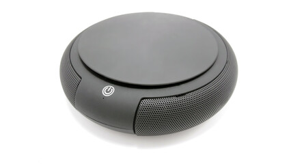 Black circular wireless sound speaker