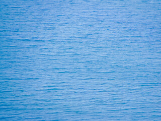 background of blue sea water surface in the afternoon