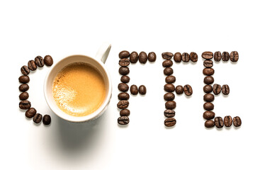 Coffee written with coffee beans and an espresso cup