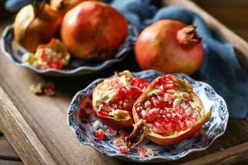 Red pomegranate in a ceramic plate