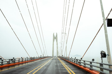 Fototapeta premium The gigantic grand bridge and beautiful skyline panorama at rainy day.