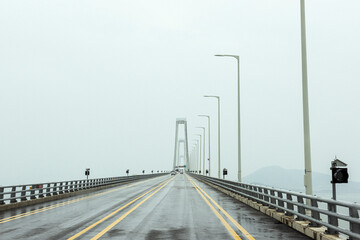 Fototapeta premium The gigantic grand bridge and beautiful skyline panorama at rainy day.