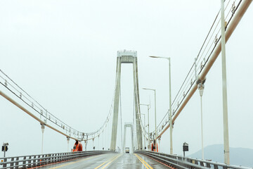 The gigantic grand bridge and beautiful skyline panorama at rainy day.