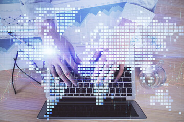 Multi exposure of businessman working on laptop on background. International business hologram in front. Concept of success.