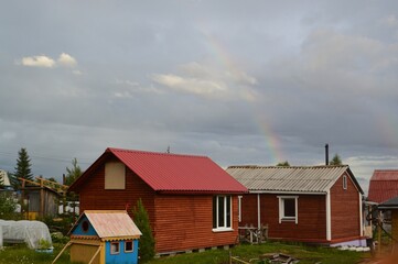 Naklejka premium rainbow at the cottage