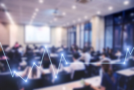 Blurred background of business people in conference hall or seminar room with Stock market or forex trading graph.