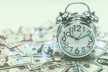 Dollar currency, American Dollars Cash Money with Alarm Clock with Stock market or forex trading graph.