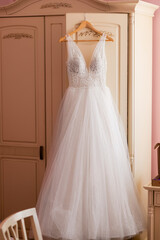 Fototapeta na wymiar wedding dress in light room