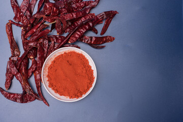 Chili powder over blue background