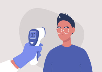 Covid-19 prevention, a hand holding a body Medical Infrared Thermometer, a young male patient