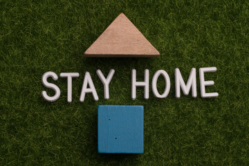 Stay at home message over green background