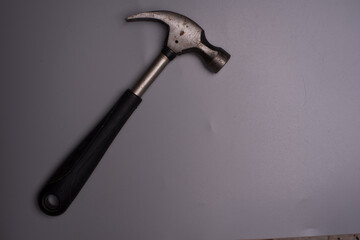 A hammer over grey surface