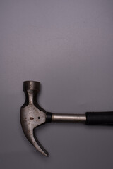 A hammer over grey surface