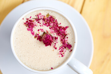 tasty cappuccono with rose petals