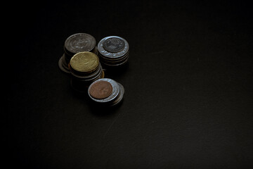 coins on black background
