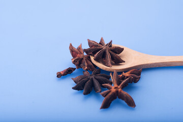Star anise isolated over blue background