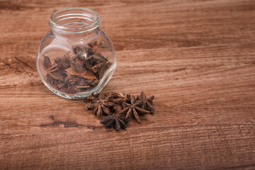 Star anise isolated over wooden background