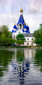 Russia, Korolev. Church of the Nativity of the Blessed Virgin Mary among the foliage.
