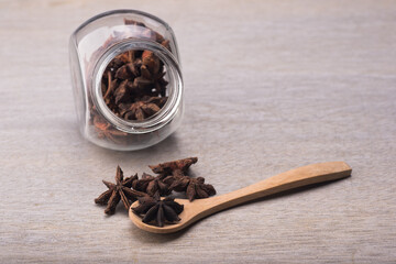 star anise over grey wooden background