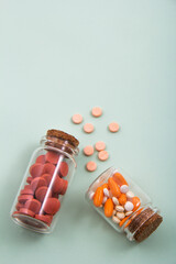 Pills and colored capsules out of the package. Color tablets and capsules from the wing view.