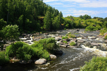 Threshold with boulders on a mountain river