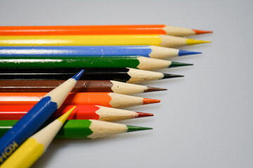 Fototapeta premium colored pencils with notebook for drawing on paper and fun