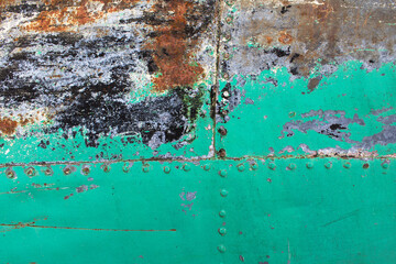 light green blue paint old rusty metal surface of boat bottom