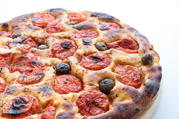 Focaccia typical of Bari Italy with tomatoes and olive