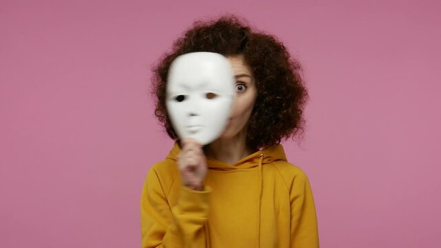 Multiple personality concept. Girl afro hairstyle acting different emotions, taking off mask changing facial expressions of happiness sadness amazement, showing various grimaces. studio shot isolated