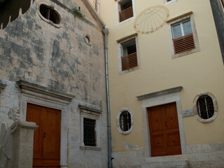 old buildings with sundial