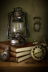 old antique clock und lamp still live latern