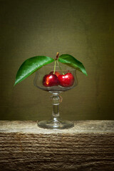 cherry on a table fruit red glass