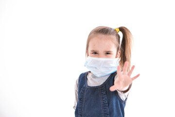 a girl in a medical mask says stop infection. the child put his hand forward. prevention of the disease. isolated on white background