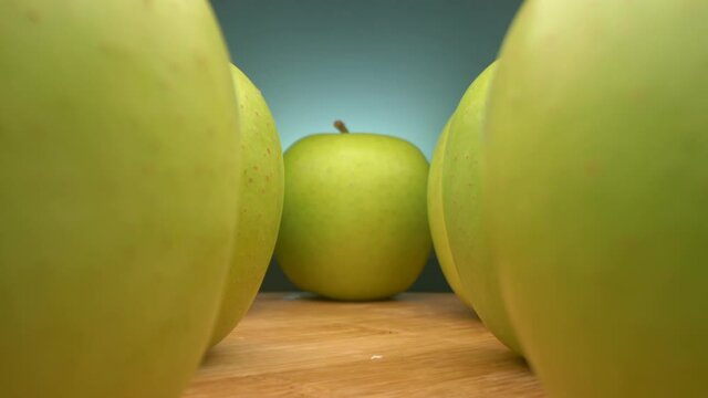 view between rows of green apples. super close up.