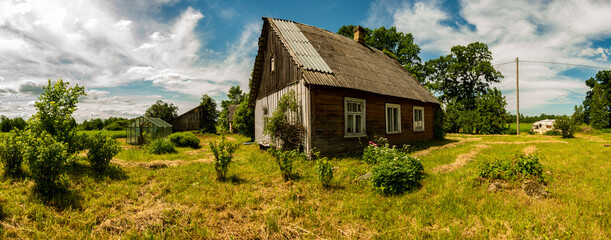 Panoramic photography, green meadow with old house