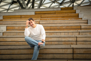 young man sitting on the stairs