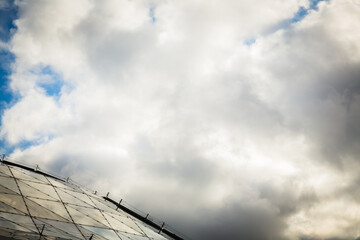 clouds over the sky above the glass roof