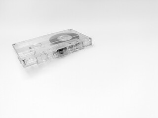 Cassette tape, object isolated on a white background, analog magnetic tape for audio recording, outdated technology