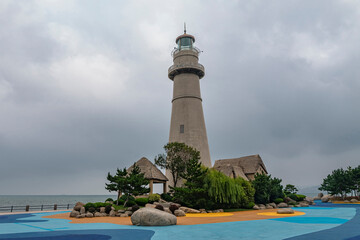 Lighthouse by day. Marine embankment of Weihai, China