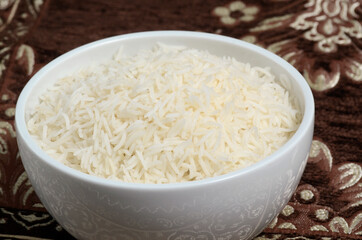 a bowl of cooked basmati rice in even lighting