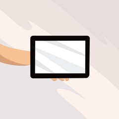 hand holding a tablet pc with the screen