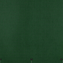 Fototapeta premium Solid dark green background. Fabric with natural texture, Cloth backdrop.