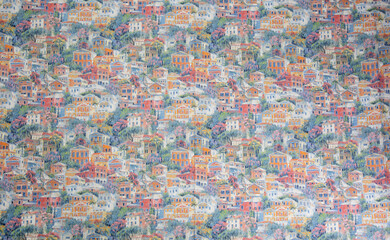 Pattern on fabric of colorful small houses. Fabric with natural texture, Cloth backdrop.