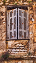 Fototapeta na wymiar old house in disrepair, window close up