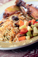 Chicken Zurbiyan served with pickles raisin topping