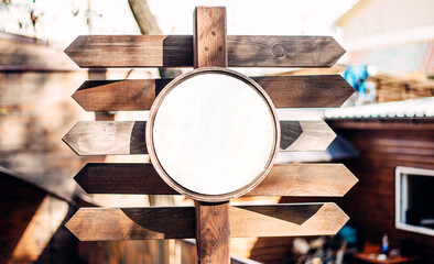 Wooden tourist pointer, travelers with backpacks pointer, white background